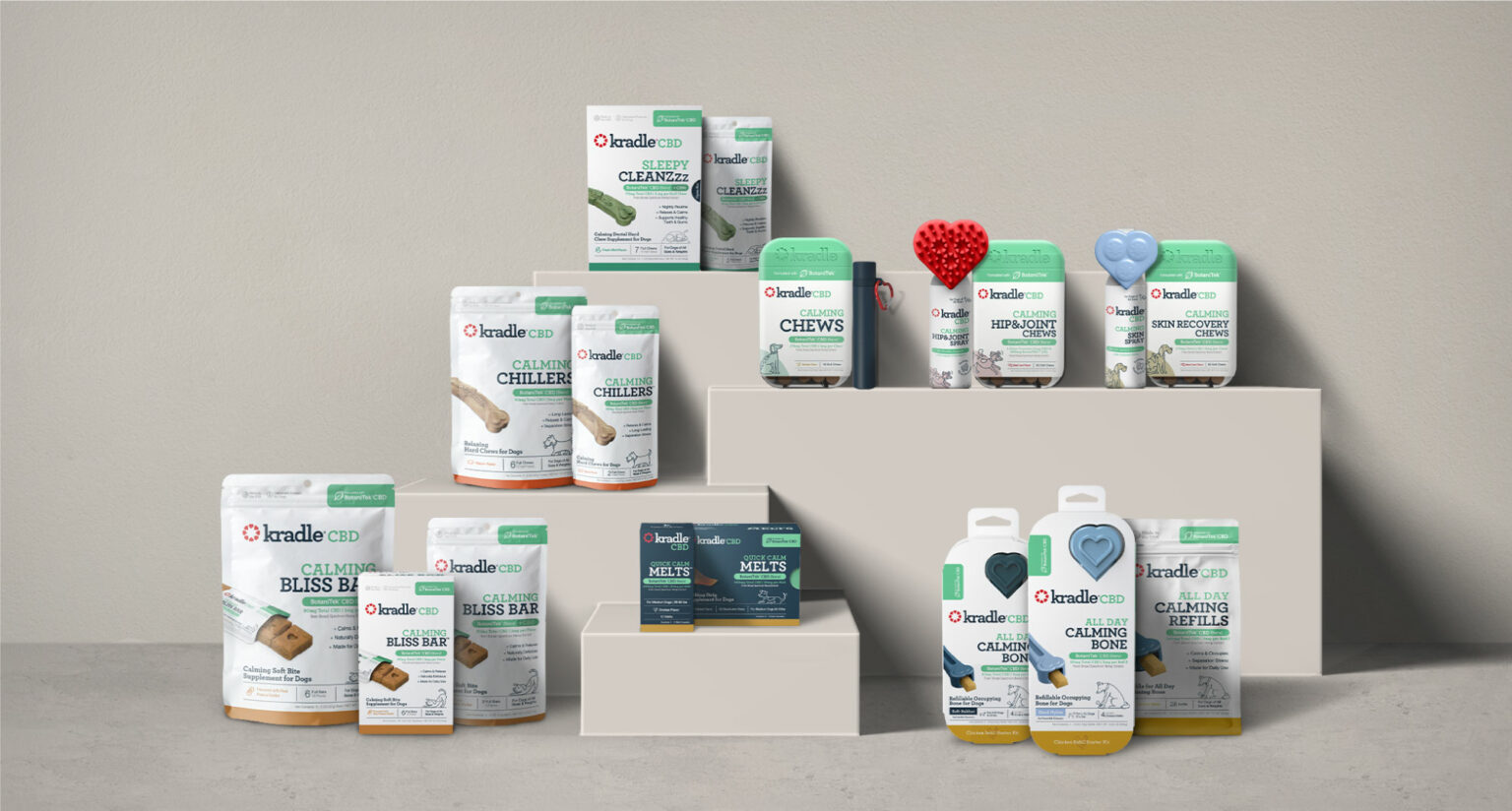 Group of Kradle CBD products displayed on multi-tier shelving.