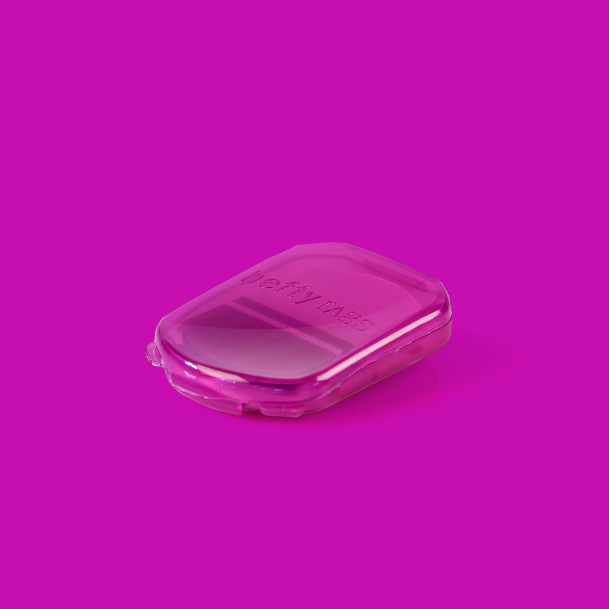 A small purple translucent container holding sticky tabs for office use, clipped shut.