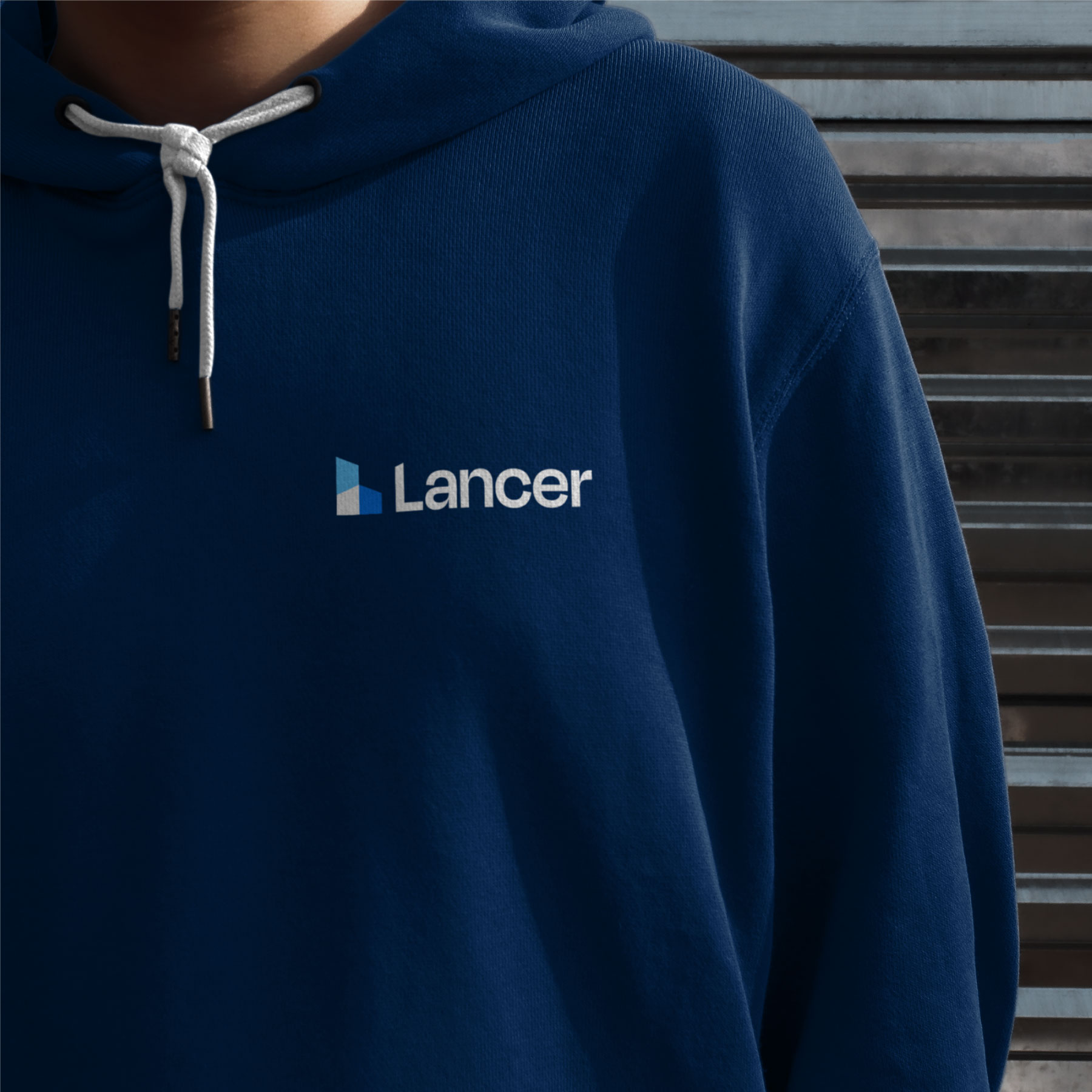 Lancer Group Properties logo on a dark blue sweatshirt.