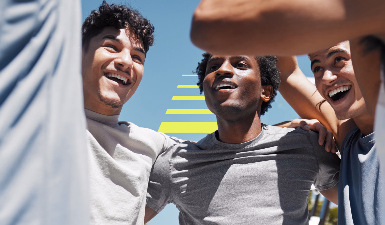 group of young men huddled together with the Strata Performance logo behind them